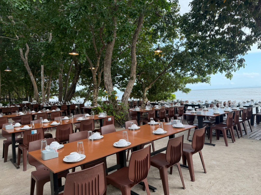 Open-air tables by the water at Branch 2 Oceanview